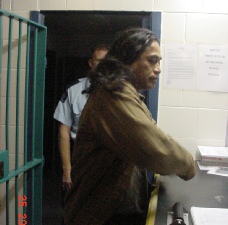 Cassidy being processed at Kaikohe Police Station. Photo - R. Atkinson