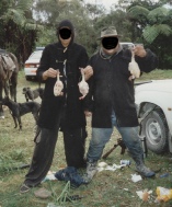 Nabbed poachers proudly display the evidence. Photo - R. Atkinson